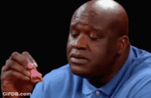 Bald Man In Blue Shirt Eating Piece Of Chicken GIF