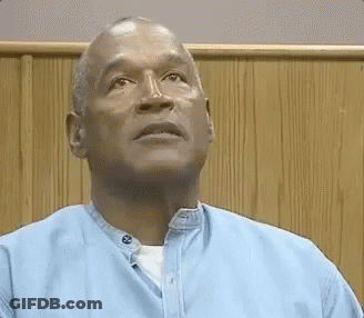 Bald Man In Blue Shirt Looking Up GIF