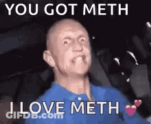 Bald Man In Blue Shirt Making Funny Face In Car GIF