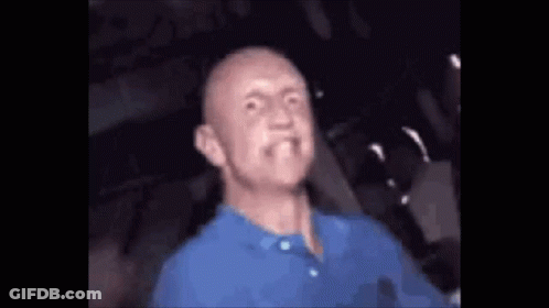 Bald Man In Blue Shirt Making Funny Face GIF