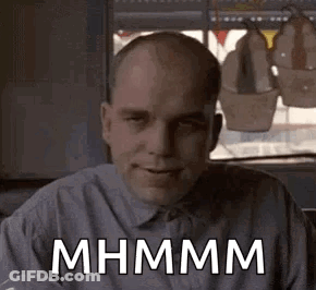 Bald Man In Blue Shirt Smiling GIF