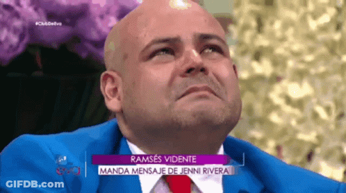 Bald Man In Blue Suit And Red Tie On TV Show GIF