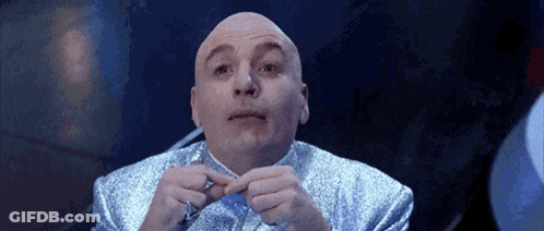 Bald Man In Blue Suit Holding Pen GIF