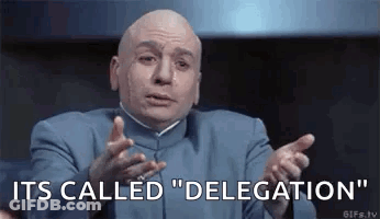 Bald Man In Blue Suit Making Funny Face Saying Its Called Delegation GIF
