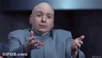 Bald Man In Blue Suit Making Gesture GIF