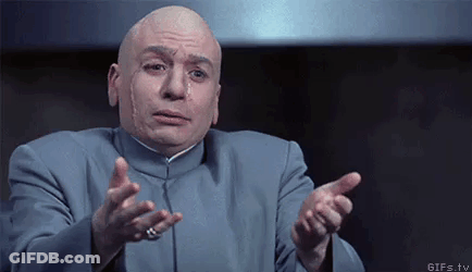 Bald Man In Blue Suit Pointing At Camera GIF