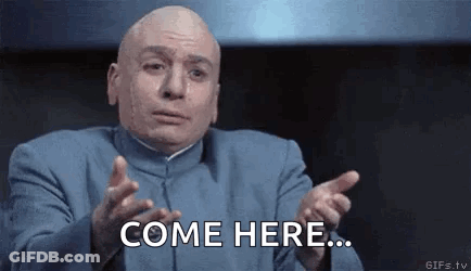 Bald Man In Blue Suit Saying Come Here GIF