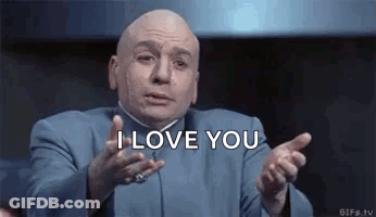 Bald Man In Blue Suit Saying I Love You GIF