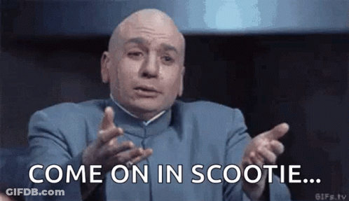 Bald Man In Blue Suit Says Come On In Scootie GIF