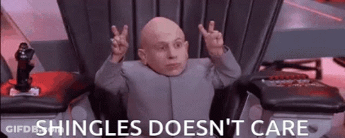 Bald Man In Chair With Hands Up Shingles Doesn't Care GIF