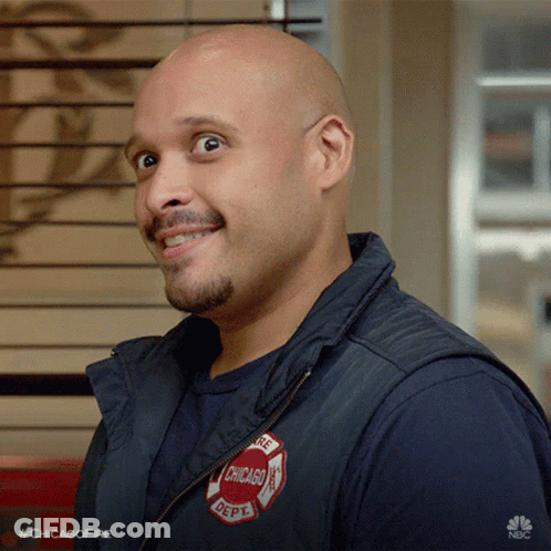 Bald Man In Chicago Fire Department Vest Smiling GIF