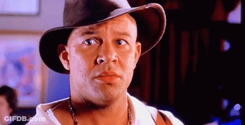 Bald Man In Cowboy Hat And Necklace GIF
