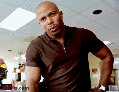 Bald Man In Front Of Dealer Sign GIF