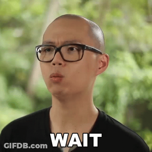 Bald Man In Glasses And Black Shirt Saying Wait GIF