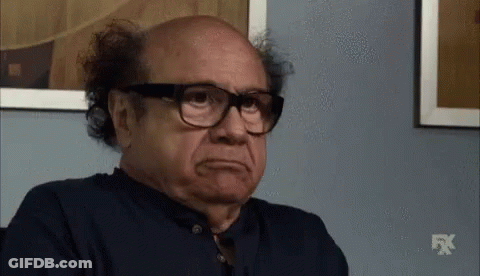 Bald Man In Glasses And Blue Shirt With FX Logo GIF