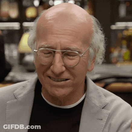 Bald Man In Glasses And Grey Jacket Smiling GIF