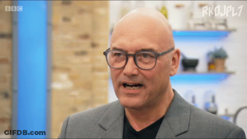 Bald Man In Glasses And Suit On BBC TV Show GIF