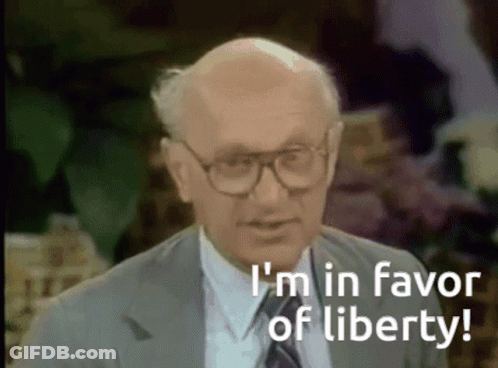 Bald Man In Glasses And Suit Says I'm In Favor Of Liberty GIF