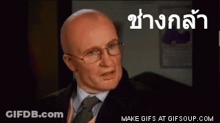 Bald Man In Glasses And Suit Speaking Foreign Language GIF