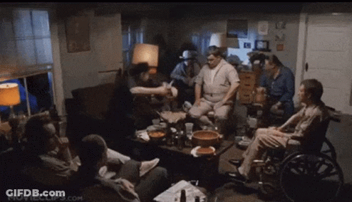 Bald Man In Gray Shirt At Window GIF