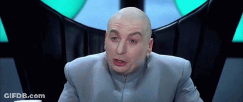 Bald Man In Gray Suit Making Funny Face GIF