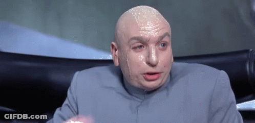 Bald Man In Gray Suit Making Funny Face GIF