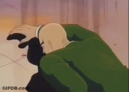 Bald Man In Green Jacket Kneeling GIF