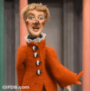 Bald Man In Green Sweater Making Funny Face GIF