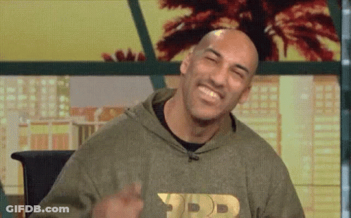 Bald Man In Hoodie Making Peace Sign GIF