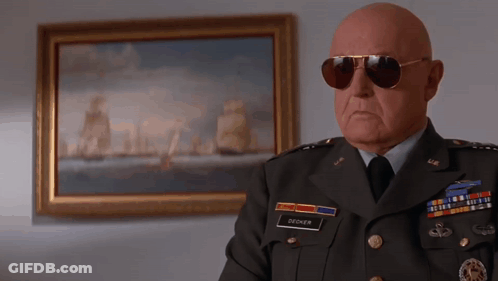 Bald Man In Military Uniform With Name Decker GIF