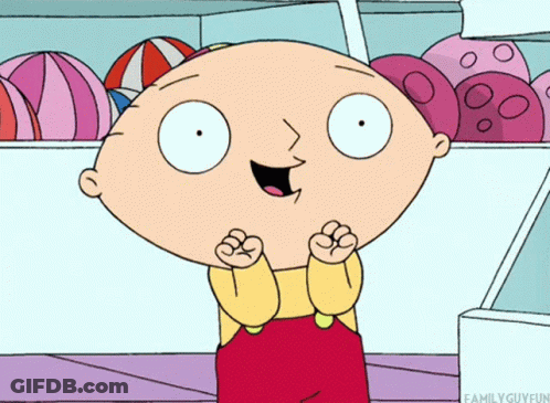 Bald Man In Orange Shirt Looking In Mirror GIF