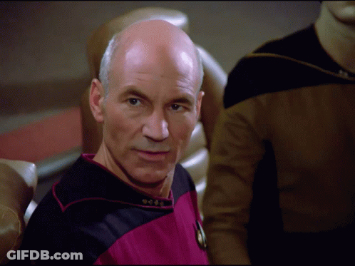 Bald Man In Pink And Black Uniform GIF
