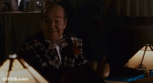 Bald Man In Plaid Shirt Giving Thumbs Up With Coin GIF
