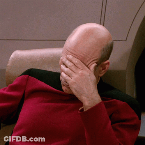 Bald Man In Red Shirt Covering Face GIF