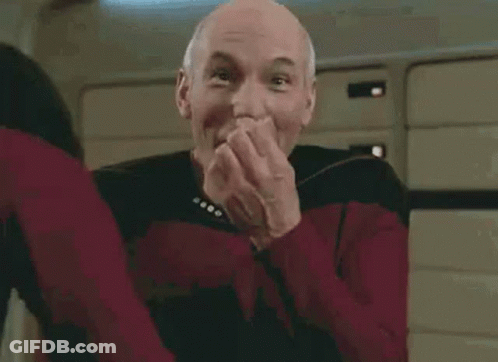 Bald Man In Red Star Trek Uniform Smiling GIF