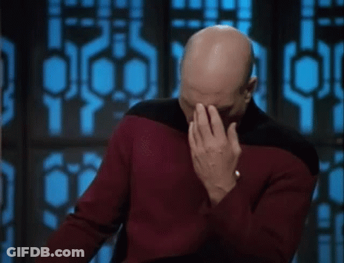 Bald Man In Red Sweater Covering Face GIF