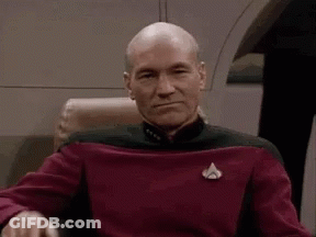 Bald Man In Red Sweater Making Face GIF