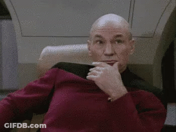 Bald Man In Red Sweater Making Face GIF