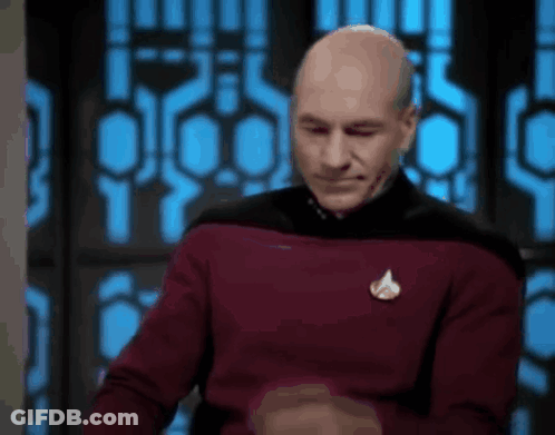 Bald Man In Red Sweater Making Funny Face By Window GIF