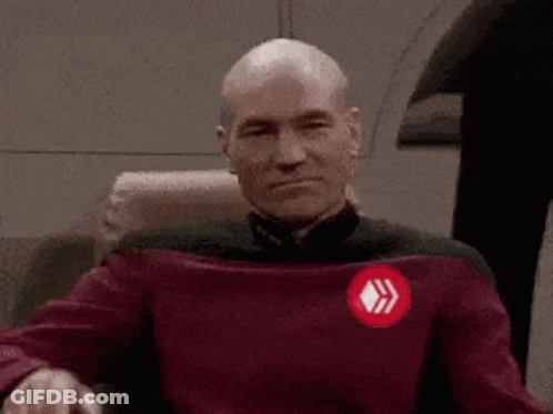 Bald Man In Red Sweater With Diamond Emblem GIF