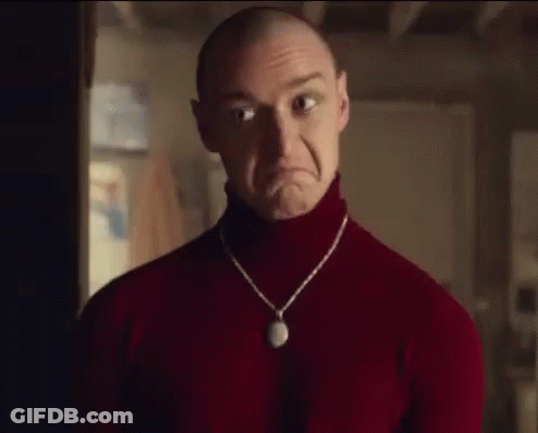 Bald Man In Red Turtleneck Making Sad Face GIF