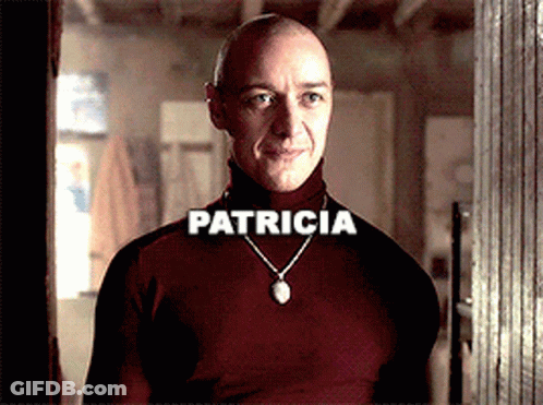 Bald Man In Red Turtleneck With Patricia Necklace GIF