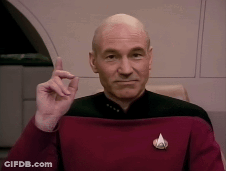 Bald Man In Red Uniform With Star Trek Badge GIF