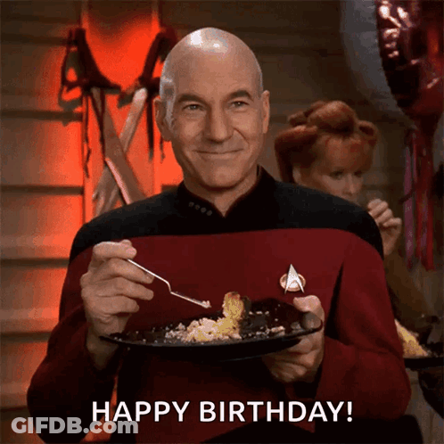 Bald Man In Star Trek Uniform Holding Plate Saying Happy Birthday GIF