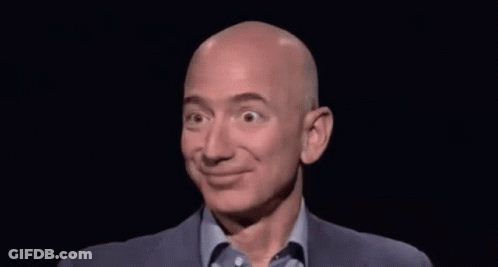 Bald Man In Suit And Blue Shirt Smiling GIF