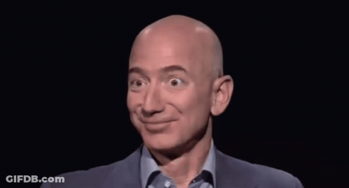 Bald Man In Suit And Blue Shirt Smiling GIF