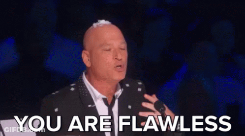 Bald Man In Suit And Tie At Microphone GIF