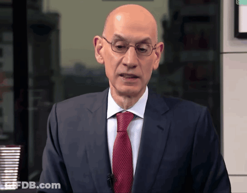 Bald Man In Suit And Tie Before Green Light GIF