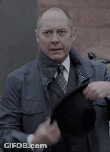 Bald Man In Suit And Tie Holding Black Hat GIF