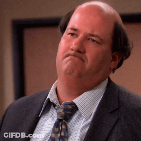 Bald Man In Suit And Tie Making Face GIF